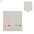 A white sticky note pad with five coloured dots in pink, yellow, and green on the front and a plain back.