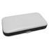 A white and black manicure set case featuring a smooth exterior and a silver clasp.