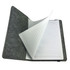A grey felt notebook with lined pages opened to display its interior. It features a simple, clean design.
