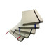 A set of Farati A5 cotton notebooks in beige, featuring elastic bands and ribbon bookmarks in various colours.
