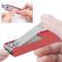 A red nail clipper with a stainless steel blade and a keyring attachment, being held by a person's hand.