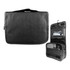 A black toiletry bag with a hook, featuring multiple compartments and a zipper. It has a simple, modern design.