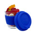 A glass coffee cup with a blue silicone sleeve, filled with various colourful jelly lollies.