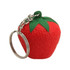 A red strawberry-shaped stress key ring with a green leaf detail and a metal keyring attachment.