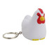A white stress rooster key ring with a red comb and yellow feet, featuring a metal keychain attachment.
