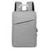 A grey laptop backpack with padded shoulder straps and a front zip pocket. It features a handle on top.