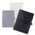 A collection of La Trobe Stone Paper Notebooks in white, grey, and black, featuring textured covers and spiral bindings.