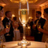 A Montio champagne flute, 185ml, made of clear glass, filled with sparkling champagne, set on a table at a festive event.