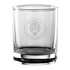 A glass tumbler with a clear design, featuring a circular logo, and a sturdy base.