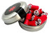 A silver tin filled with red rock candy pieces, some displaying black and white designs, with a black lid featuring a red star.