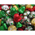 Colourful chocolate bells in red, green, gold, and silver wrappers, piled together in a festive arrangement.