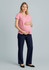 A maternity pant in navy blue, paired with a pink top, worn by a pregnant model. Features a logo.
