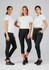 Three models wearing black women's 3/4 leggings and white t-shirts, posed together. One model has hands in pockets.