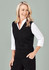 A black women's vest with a v-neck design, styled over a white long-sleeve shirt, featuring a fitted silhouette.