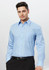 A light blue long sleeve shirt with a button-up design and a single chest pocket, featuring a logo.