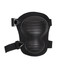 A black knee pad with adjustable straps and a textured protective surface. It features a logo on the design.