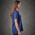 A women's navy polo shirt with a classic fit and short sleeves. Features a logo on the chest.