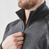 A men's quarter-zip pullover in grey, featuring a collar and a zip closure, with a branding logo.
