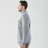A grey thermal 1/4 zip pullover for men, featuring a standing collar and side pockets.