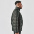 A men's Montserrat thermal jacket in dark green, featuring a quilted design and a high collar, with a logo.