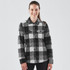 A women's black and grey plaid shacket with a button-up front and two chest pockets, featuring a logo.