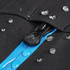 A close-up of a black softshell jacket featuring a blue zipper and droplets of water on the fabric.