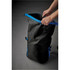 A black and blue backpack with adjustable straps, being opened by a pair of hands. It has a sleek, waterproof design.