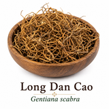 Long Dan Cao (Gentiana scabra), premium dried Chinese Gentian Root presented in a wooden bowl.