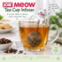 JOIE MEOW cat loose leaf tea infuser perched on a glass mug while the stainless steel mesh tea ball steeps loose tea in hot water.