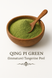 Green Immature Tangerine Peel, also known as Qing Pi, in powder form, in a wooden bowl, showing the fine powder consistency