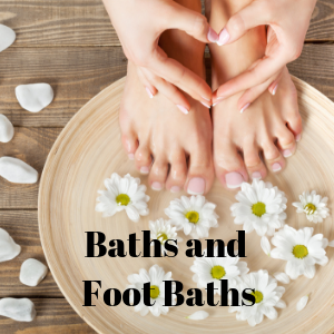 Photo of someone's feet already dipped in a relaxing herbal foot bath which could also be expanded to a whole herbal bath to fill your whole bathtub with herbs like taking a dip in pure herbal tea