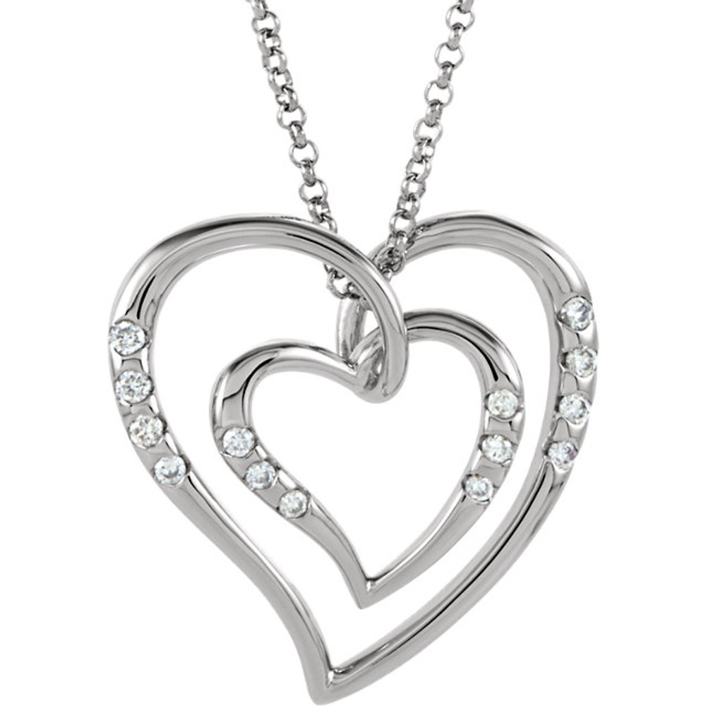 This elegant 14k white gold necklace features a heart adorned with sparkling round diamonds. Diamonds are 1/10ctw and are H-I in color and I1 or better in clarity. Necklace is suspended from a 14k white gold chain and has a bright polish to shine.