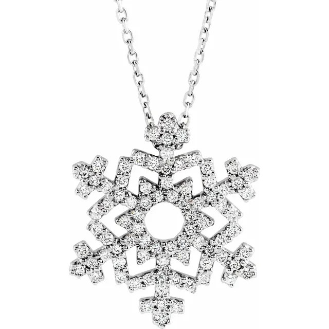 This beautiful and modern diamond pendant for women features brilliant-cut bright round diamonds set in a sparkling 14kt white gold prong setting. This nature themed pendant is uniquely shaped as a snow flake.
