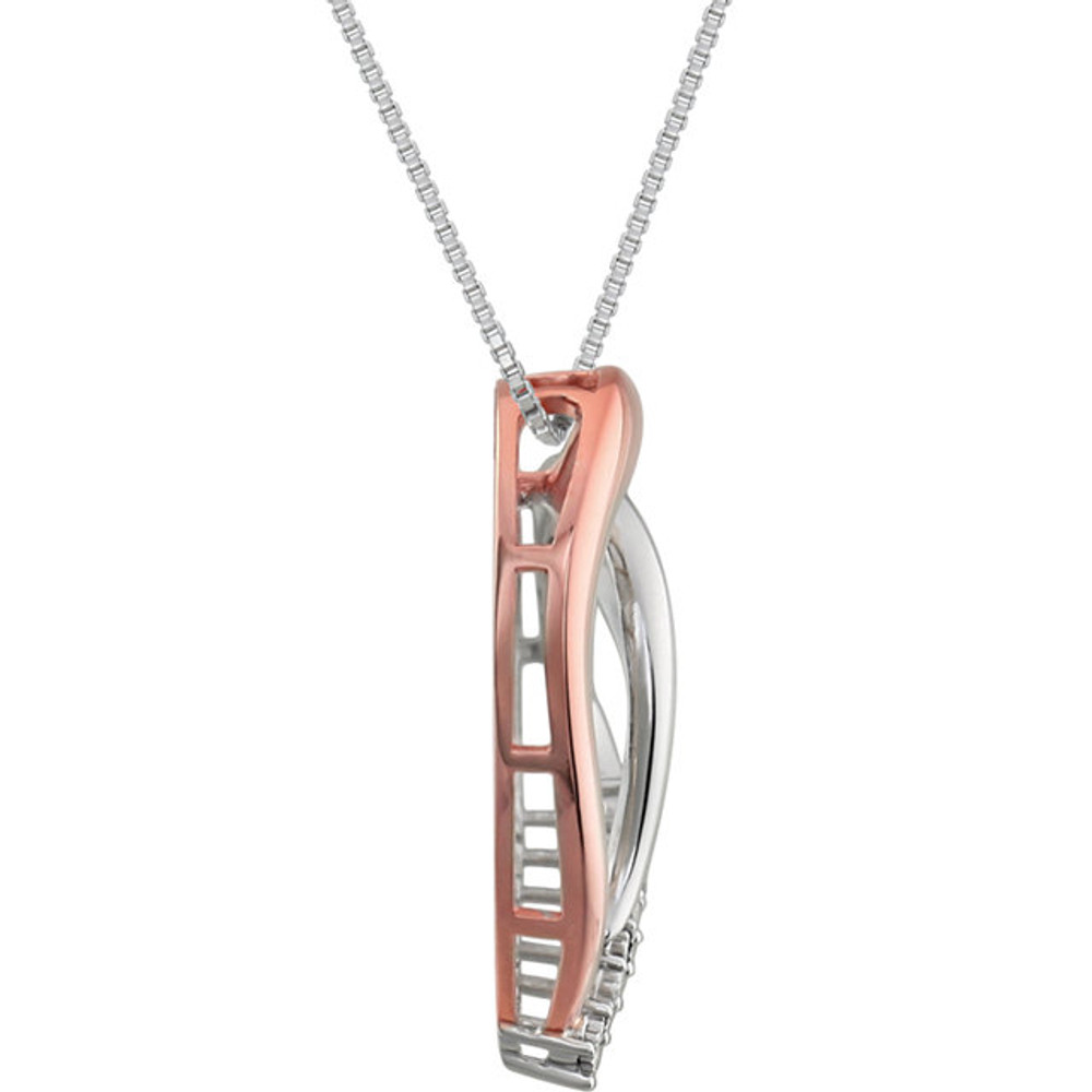 This 14K Rose Gold/Sterling Silver pendant features a romantic heart with round cut diamonds. Diamonds are .02ctw, G-I in color, and I3 or better in clarity. Pendant is presented on an 18 inch sterling silver rope chain.