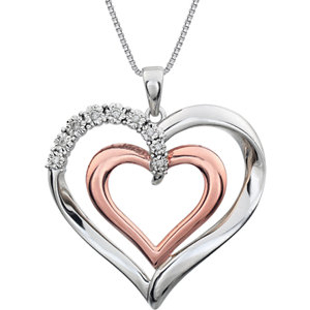 This 14K Rose Gold/Sterling Silver pendant features a romantic heart inside of a heart adorned with round diamonds. Diamonds are .06ctw, G-I in color, and I3 or better in clarity. Pendant is 32mm in diameter and is presented on an 18 inch sterling silver rope chain.