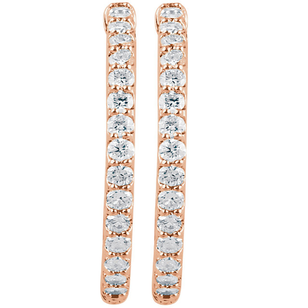 Classic in style, these diamond hoop earrings feature 52 round diamonds prong-set throughout the 14k rose gold settings. Polished to a brilliant shine.