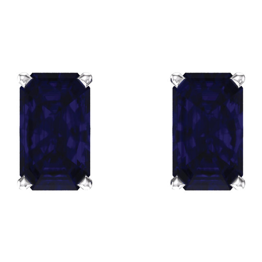 These lovely 14k white gold earrings each feature a created 5 x 3mm Emerald/Octagon blue sapphire. Polished to a brilliant shine.