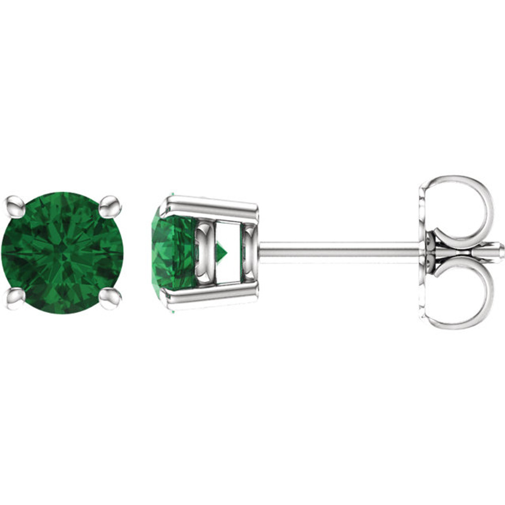 Lush with the dark green hue of nature itself, Emeralds pulse with vitality and are representative of life and excitement. This simple stud design features a 5mm genuine emerald cradled in a 4-prong basket of 14k white gold finished with a tension back post. Total carat weight for the pair is 1.40.