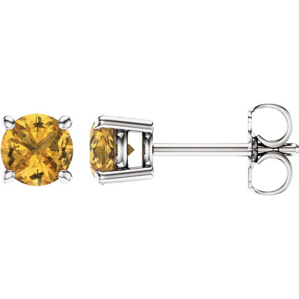 Deeply rich in color, these yellow sapphire earrings are complemented by 14k white gold four-prong settings and make a simply striking gift.