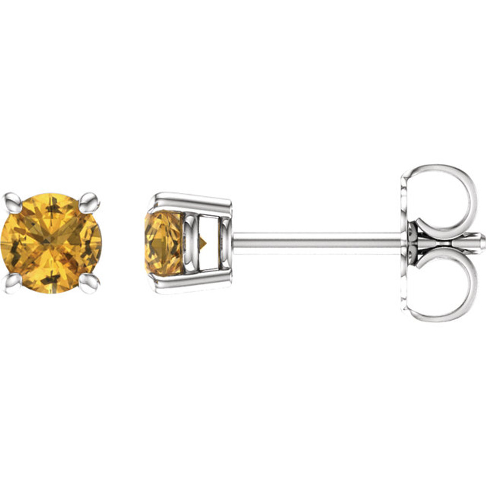 Deeply rich in color, these yellow sapphire earrings are complemented by 14k white gold four-prong settings and make a simply striking gift.