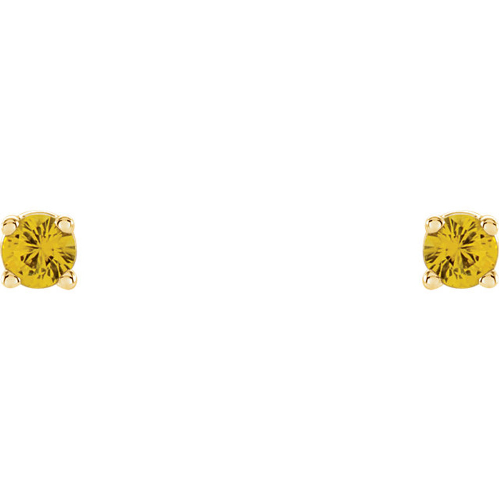 Deeply rich in color, these yellow sapphire earrings are complemented by 14k yellow gold four-prong settings and make a simply striking gift.