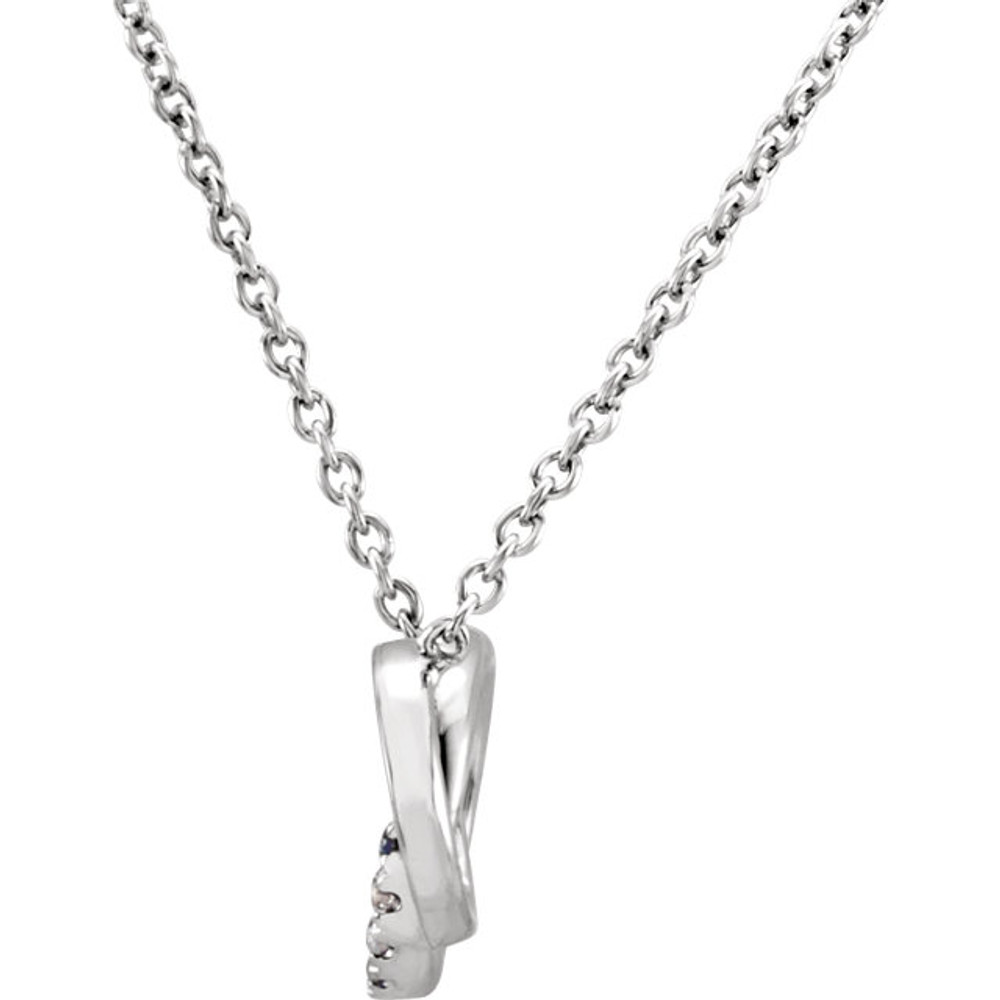 This 14k white gold necklace features two interlocking diamond adorned loops. Diamonds are .06ctw, J or better in color, and I2 or better in clarity. Pendant is 7.6mm in length and 11mm in width and is displayed on an 18inch chain.