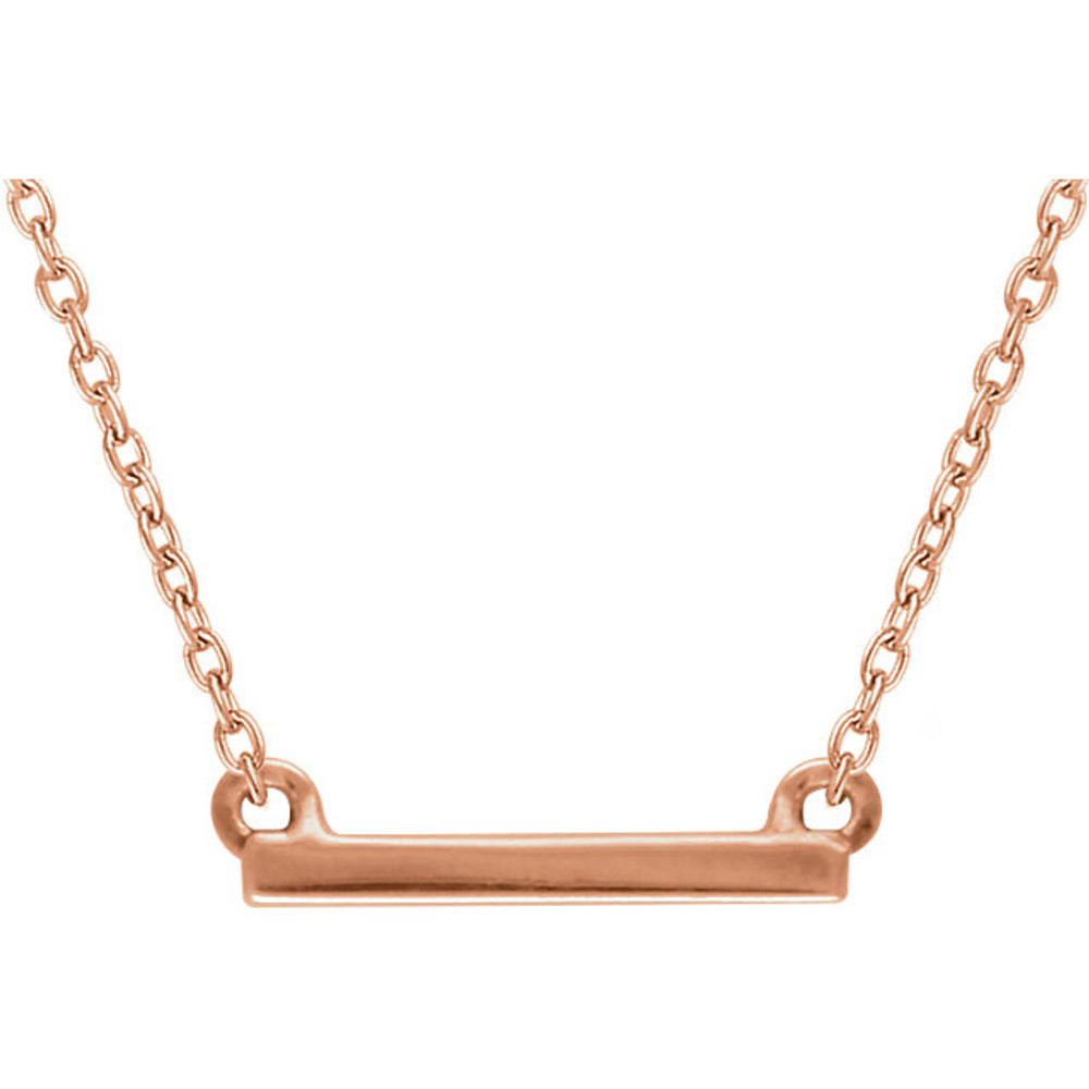 This trendy pendant features a 14k gold bar that is 1.5mm in length and 12mm in width. Pendant is displayed on an 18inch 14k gold cable chain.