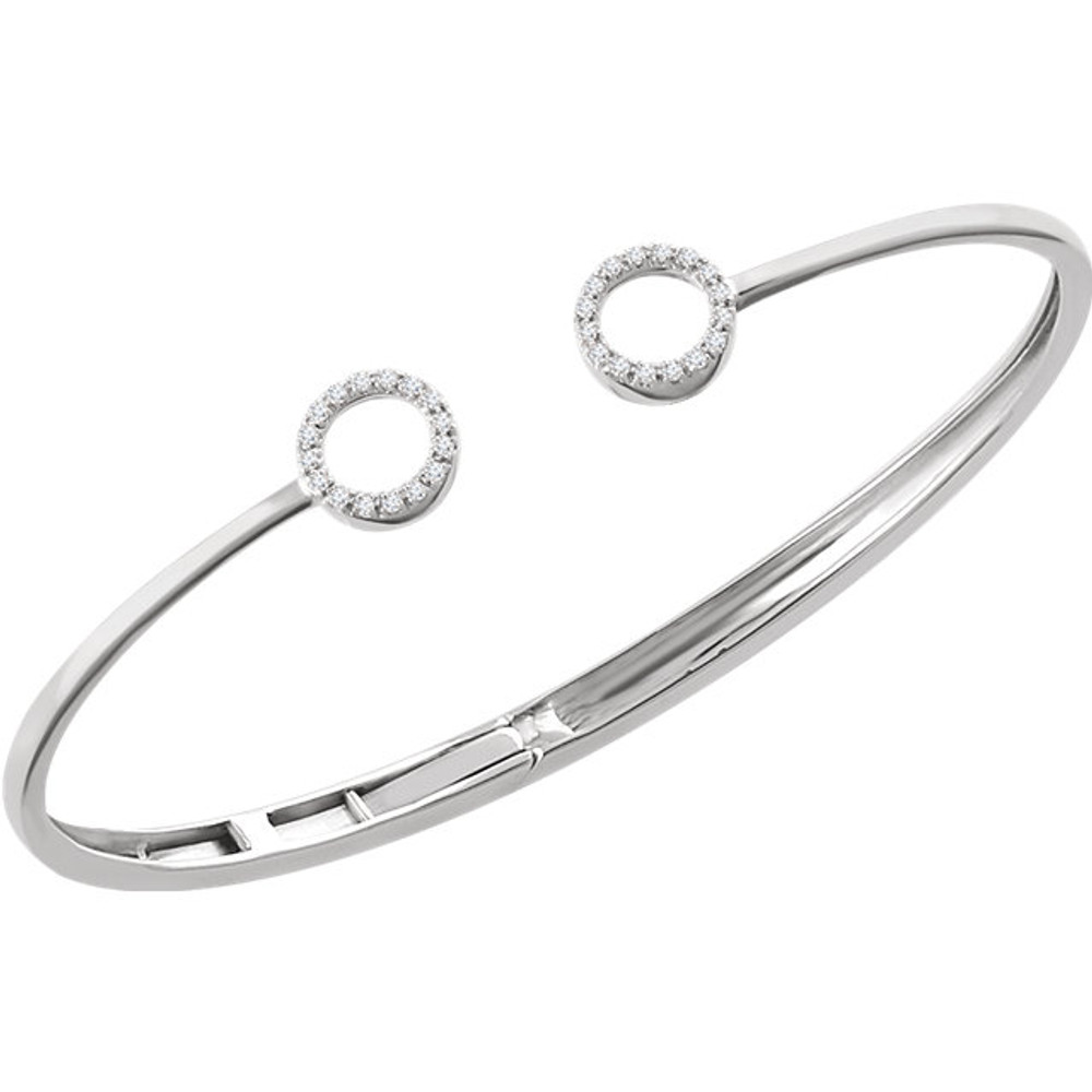 This 14k white gold diamond circle hinged bangle 7" bracelet will light up your wrist! Diamonds are 1/6ctw, H+ or better in color, and I1 or better in clarity.