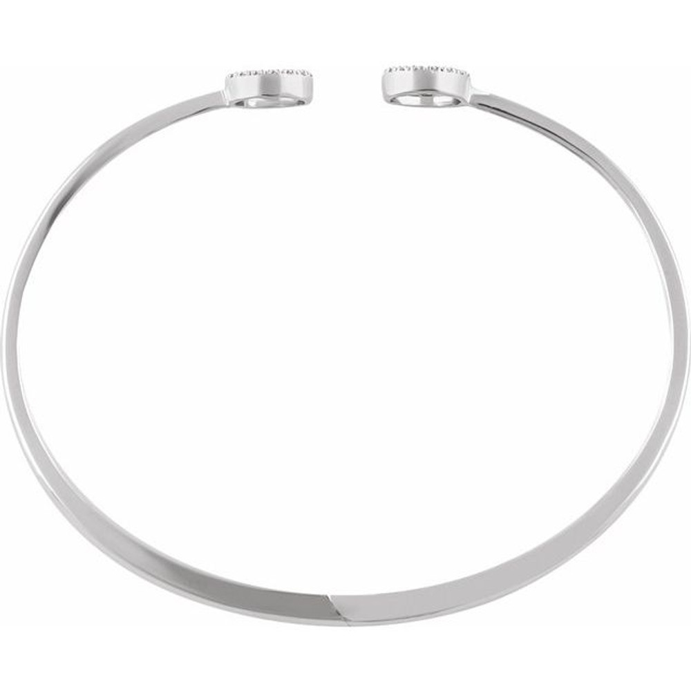 This 14k white gold diamond circle hinged bangle 7" bracelet will light up your wrist! Diamonds are 1/6ctw, H+ or better in color, and I1 or better in clarity.