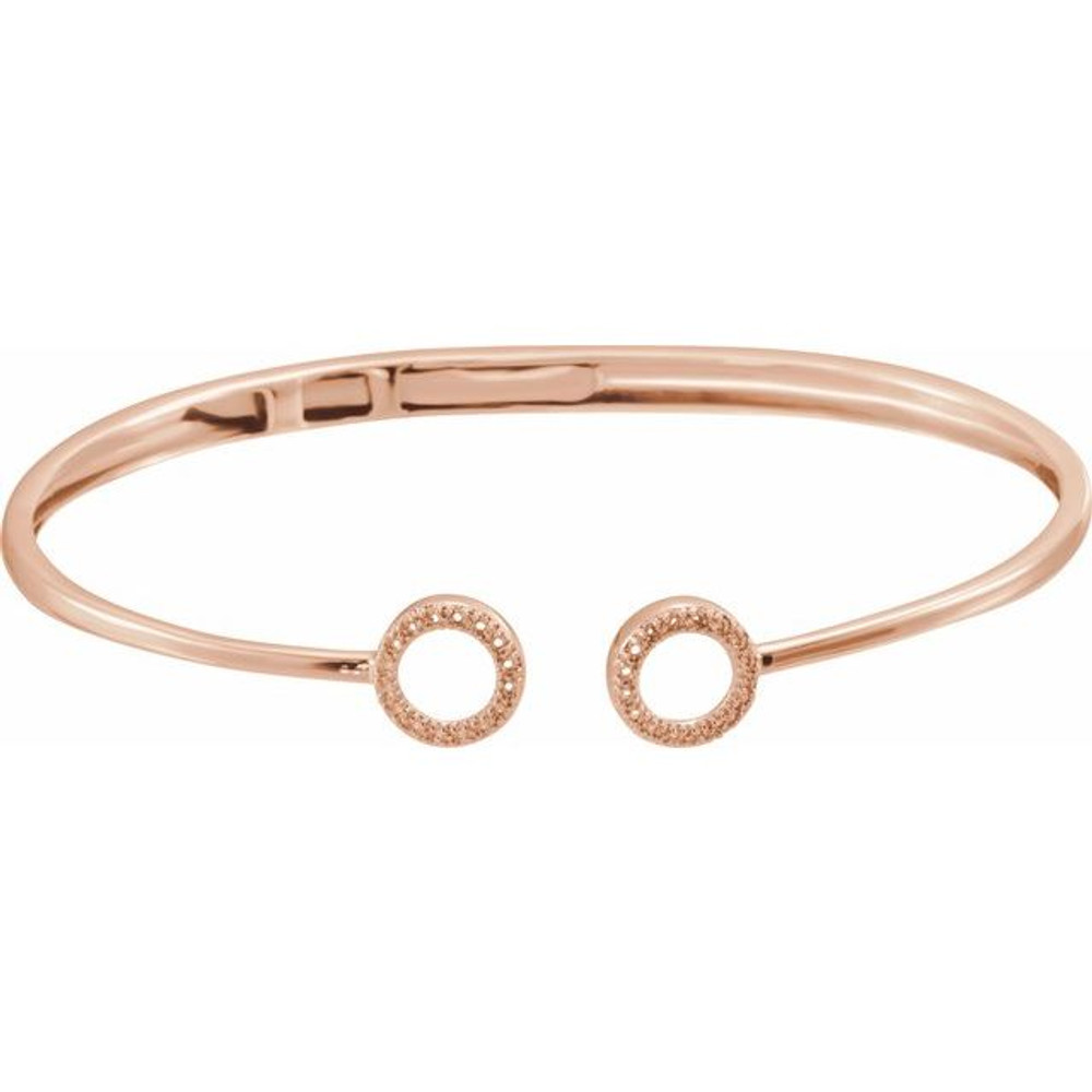 This 14k rose gold diamond circle hinged bangle 7" bracelet will light up your wrist! Diamonds are 1/6ctw, H+ or better in color, and I1 or better in clarity.