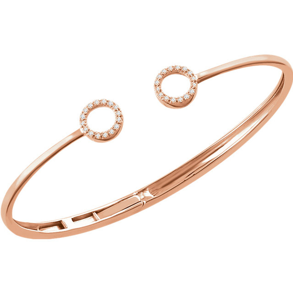 This 14k rose gold diamond circle hinged bangle 7" bracelet will light up your wrist! Diamonds are 1/6ctw, H+ or better in color, and I1 or better in clarity.