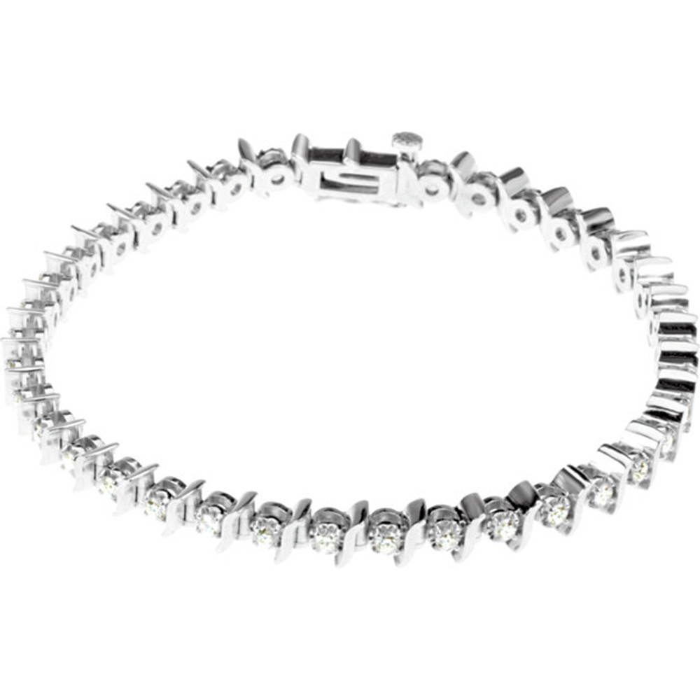 Sparkling, brilliant cut diamonds are set in a classic 14k white gold, four-prong 7.25" tennis bracelet.