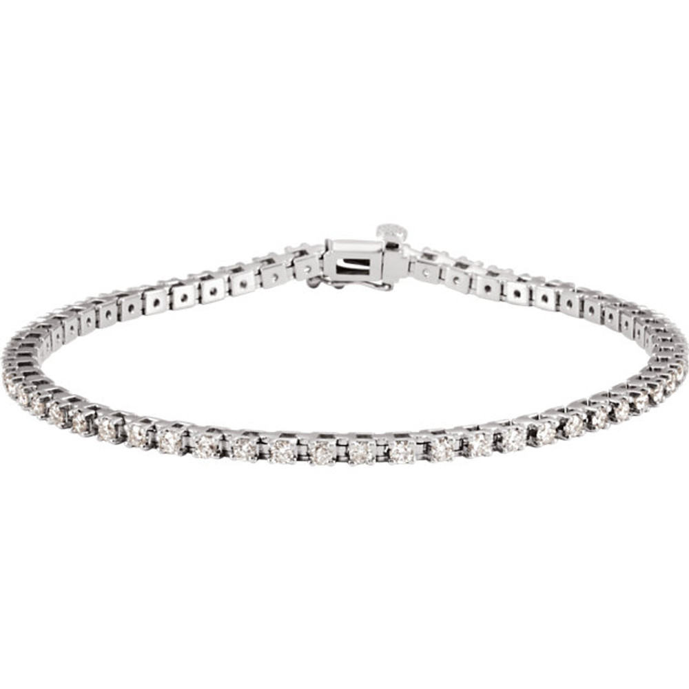 Sparkling, brilliant cut diamonds are set in a classic 14k white gold, four-prong 7.25" tennis bracelet.