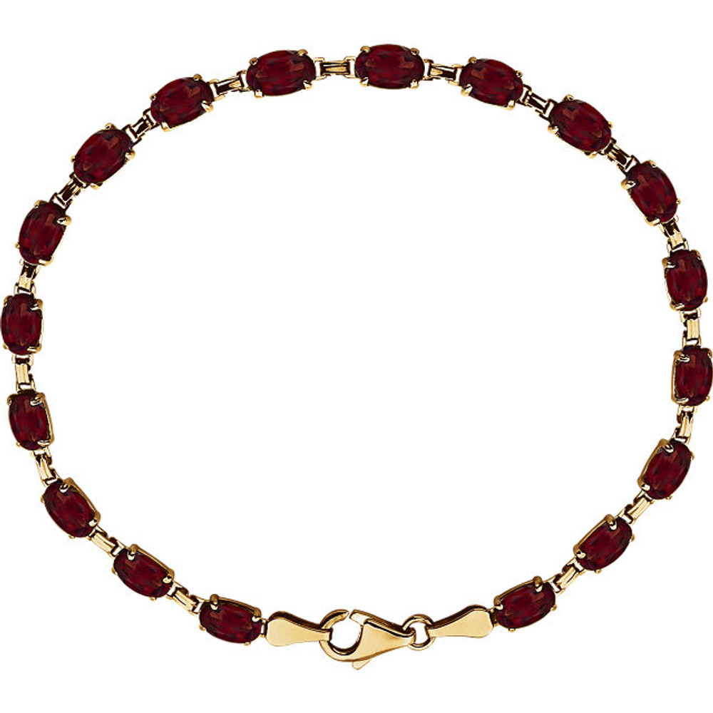 Brilliant oval genuine mozambique garnet's 6x4mm are set in 14k yellow gold in this eye-catching bracelet.
